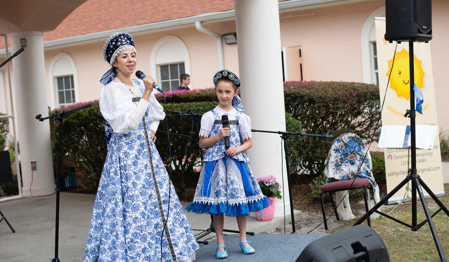 Slavic folk performers in traditional costume on stage